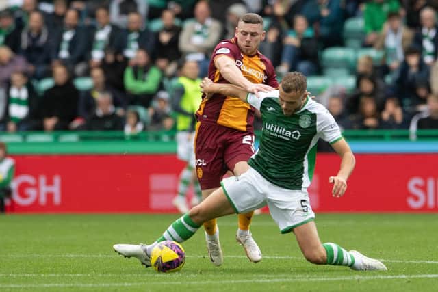 Motherwell's Connor Shields pulls down Hibs defender Ryan Porteous before being sent off. (Photo by Ross Parker / SNS Group)