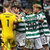 Celtic's Joe Hart celebrates with Cameron Carter-Vickers, Liam Scales and Matt O'Riley after winning the shootout against Aberdeen.