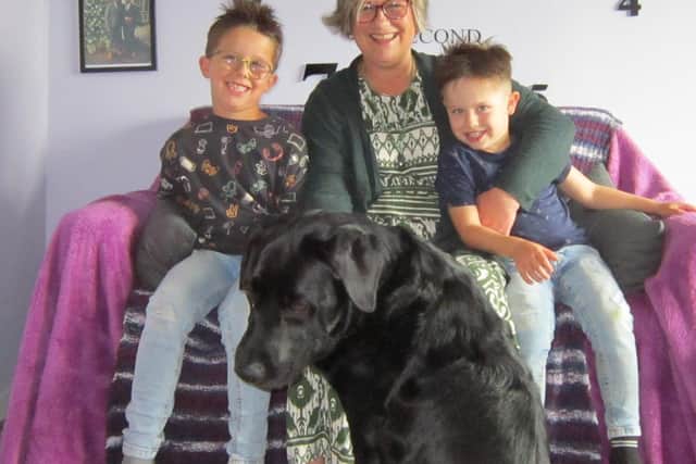 Joann with her grandchildren, Orson (6) and Ovie (3), and Dudley
