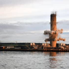 The 600ft chimney at the site of Scotland's last remaining coal fired power station came down this morning.