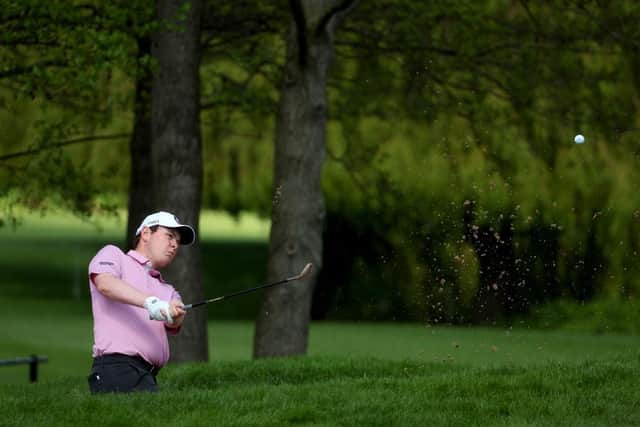 Bob MacIntyre saves par from a bunker at the first in the third round of the Betfred British Masters hosted by Danny Willett at The Belfry. Picture: Andrew Redington/Getty Images.