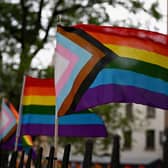 The much more inclusive New Pride Flag which integrates the Trans Pride Flag along with a black and brown stripe for People of Colour. (Photo by ANGELA WEISS/AFP via Getty Images)