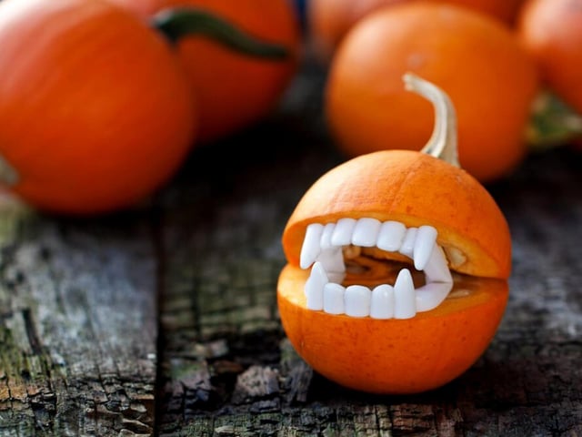 Another efficient design if you've got leftover Halloween props lying around. All you have to do is hollow out an average mouth shape on your pumpkin then slot those plastic dentures in - the result is fang'tastic (couldn't resist) and you lose very little time creating it.