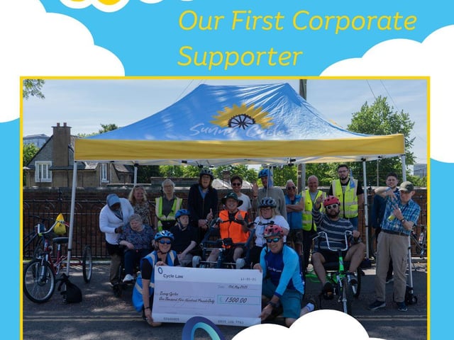 Rod Mitchell of Cycle Law Scotland hands over cheque for £1500 to Sunny Cycles