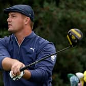 Bryson DeChambeau plays his shot from the 18th tee during the second round of the Masters at Augusta National/ Jamie Squire/Getty Images