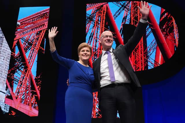 First Minister Nicola Sturgeon alongside Deputy First Minister John Swinney after his speech at the SNP conference at The Event Complex Aberdeen (TECA) in Aberdeen , Scotland.