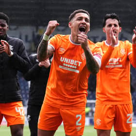 Rangers' James Tavernier (centre) and team-mates celebrate in front of the fans following victory in the William Hill Premiership match at Falkirk Stadium. (Photo by Andrew Milligan/PA Wire)