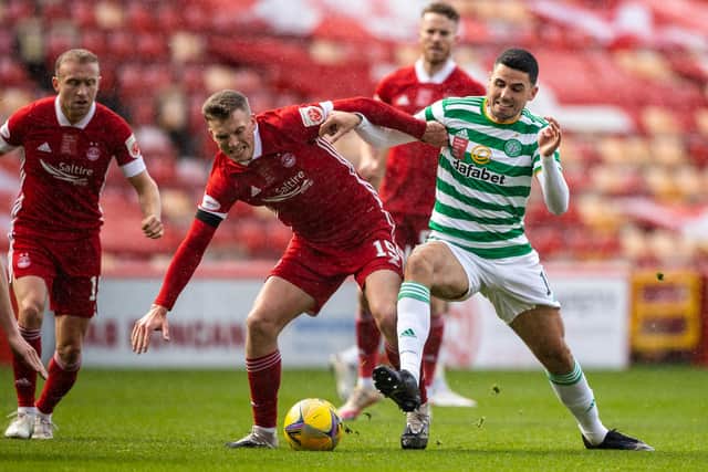 Aberdeen's Lewis Ferguson challenged by Tom Rogic in last week's 3-3 draw between the Scottish Cup semi-finalists in which the Pittodire midfielder netted twice from the spot (Photo by Craig Williamson / SNS Group)