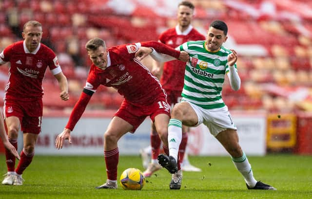 Aberdeen's Lewis Ferguson challenged by Tom Rogic in last week's 3-3 draw between the Scottish Cup semi-finalists in which the Pittodire midfielder netted twice from the spot (Photo by Craig Williamson / SNS Group)