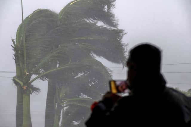 A man films the impacts of the high winds in Punta Gorda, Florida, as Hurricane Ian battered the state. Picture: Getty Images