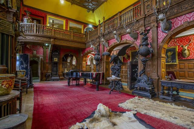 The Grand Hall at Kinloch Castle, with the possessions of the Bullough family remaining in place, much as they were left. PIC: SWNS.
