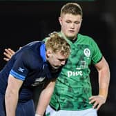 Scotland's Johnny Rutherford is consoled at full time by an Irish counterpart after the heavy loss at Scotstoun.