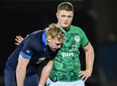 Scotland's Johnny Rutherford is consoled at full time by an Irish counterpart after the heavy loss at Scotstoun.