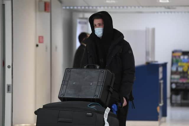 Central defender Jack Simpson arrives at Glasgow Airport on Monday before completing his move from Bournemouth to Rangers. (Photo by Ross MacDonald / SNS Group)