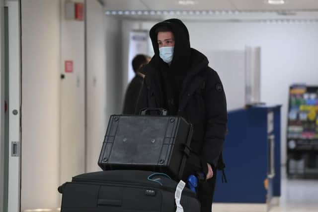 Central defender Jack Simpson arrives at Glasgow Airport on Monday before completing his move from Bournemouth to Rangers.  (Photo by Ross MacDonald / SNS Group)