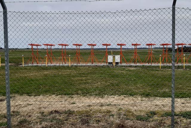 The path skirts round the end of the Inverness Airport runway. Picture: The Scotsman