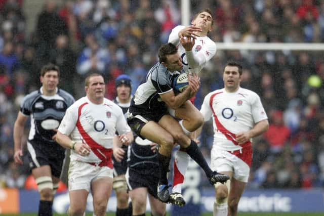 England inside centre Toby Flood loses out to Scotland scrum-half Mike Blair under the high ball during the Six Nations match at Murrayfield in 2008. Scotland won 15-9. (Photo: PAUL ELLIS/AFP via Getty Images)