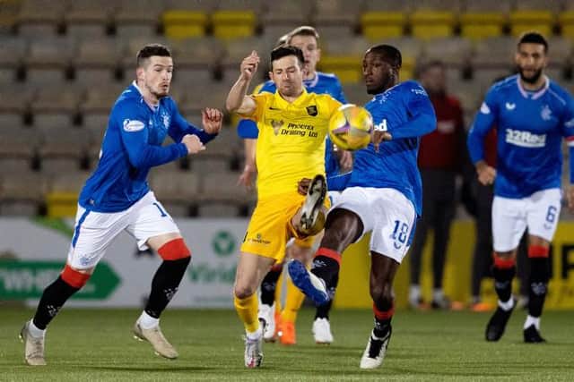Livingston midfielder Jason Holt battles for possession with Ryan Kent (left) and Glen Kamara during Rangers' 1-0 win at the Tony Macaroni Arena on Wednesday. (Photo by Alan Harvey / SNS Group)