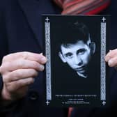 A mourner holds the order of service for the funeral of Shane MacGowan at Saint Mary's of the Rosary Church, Nenagh, Co. Tipperary. Picture: Damien Eagers/PA Wire