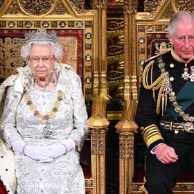 Queen Elizabeth II and the-then Prince Charles and now new King