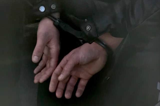 Two Scots are among eight men who have been charged with more than 30 offences