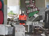 Workers have begun an operation to clear up thousands of tonnes of waste dumped by fly-tippers in Glasgow. Picture: John Devlin