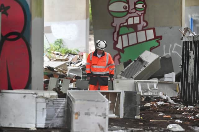 Workers have begun an operation to clear up thousands of tonnes of waste dumped by fly-tippers in Glasgow. Picture: John Devlin