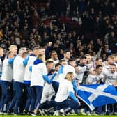 The Scotland squad celebrate qualifying for Euro 2024 after full-time against Norway on Sunday night (Photo by Alan Harvey / SNS Group)