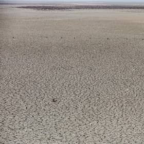 The dried-up bed of Lake Hamrin in eastern Iraq is one sign of the severity of the drought affecting much of the region (Picture: Ahmad al-Rubaye/AFP via Getty Images)