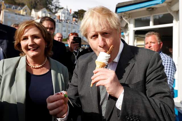 Boris Johnson eats an ice-cream as he visits Llandudno in Wales (Picture: Phil Noble/PA Wire)