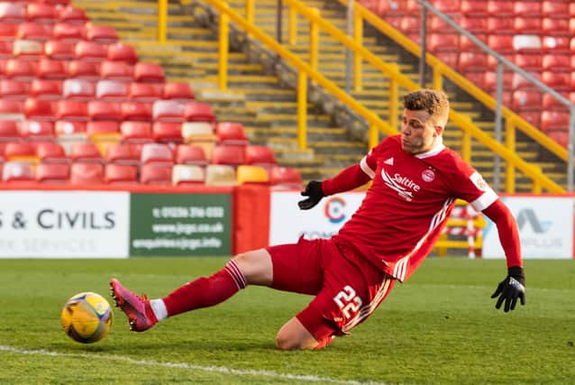 Florian Kamberi slides in to score Aberdeen's second equaliser in their eventual shootout win over Livingston. It was the striker's first goal for the club  (Photo by Ross Parker / SNS Group)