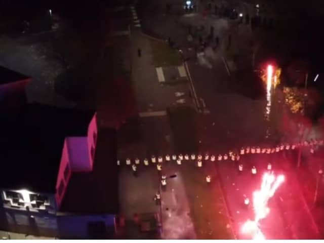 Police officers are targeted with fireworks in Niddrie, Edinburgh, during chaotic scenes on Bonfire Night