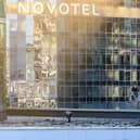 Investigators examine an area next to a damaged building in the "Moscow City" business district after a reported drone attack in Moscow, early on Tuesday.