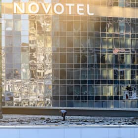 Investigators examine an area next to a damaged building in the "Moscow City" business district after a reported drone attack in Moscow, early on Tuesday.
