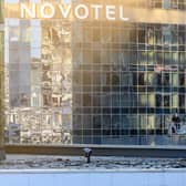 Investigators examine an area next to a damaged building in the "Moscow City" business district after a reported drone attack in Moscow, early on Tuesday.