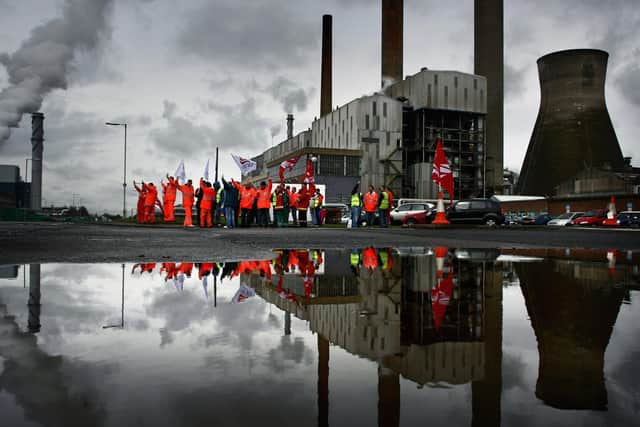 Workers picket during a past strike at the Grangemouth oil refinery. Picture: Jeff J Mitchell/Getty Images