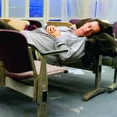 Tom Hanks makes himself comfortable during his stay in an airport in New York in The Terminal