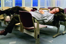 Tom Hanks makes himself comfortable during his stay in an airport in New York in The Terminal