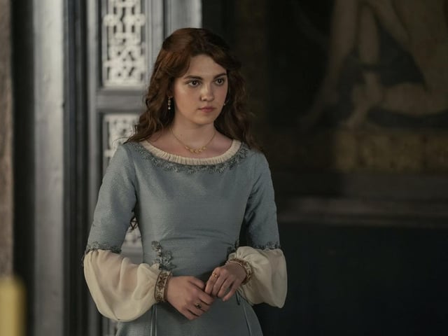 Alicent Hightower (Emily Carey and Olivia Cooke) is the second wife of King Viserys, and part of an extremely old and powerful house in Westeros. At the start of the series, she is best friends with Rhaenyra Targaryen and her father Otto Hightower is Hand of the King to Viserys.
