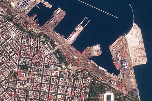 This satellite photo provided by Planet Labs PBC shows the Sierra Leone-flagged cargo ship Razoni, center with white masts, docked at the port in Odesa, Ukraine. Picture: Planet Labs PBC via AP