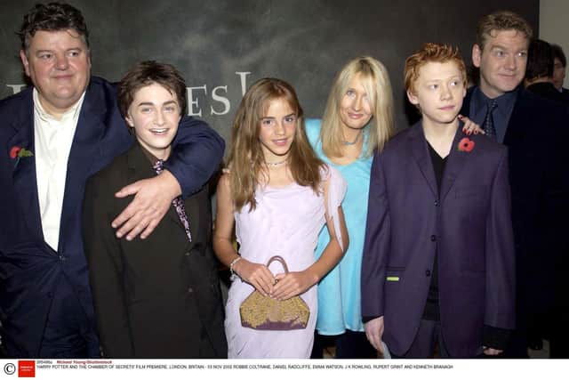 Robbie Coltrane, Daniel Radcliffe, Emma Watson, JK Rowling, Rupert Grint and Kenneth Branagh at the premiere in London of Harry Potter and the Chamber of Secrets in 2002. Photo: Richard Young/Shutterstock.