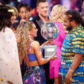 Hamza Yassin and Jowita Przystal with their trophy after winning Strictly Come Dancing 2022