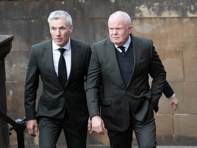 Celtic FC kitmen Hughie Hoolighan and Steve Wright arrive at the funeral of Rangers kitman Jimmy Bell