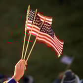 A fan holds American flags during the opening day of the 43rd Ryder Cup at Whistling Straits. Picture: Mike Ehrmann/Getty Images.