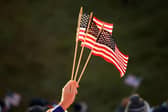 A fan holds American flags during the opening day of the 43rd Ryder Cup at Whistling Straits. Picture: Mike Ehrmann/Getty Images.