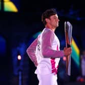 Tom Daley carries the Queen’s Baton during the Opening Ceremony of the Birmingham 2022 Commonwealth Games at Alexander Stadium in Birmingham (Picture: Elsa/Getty Images)