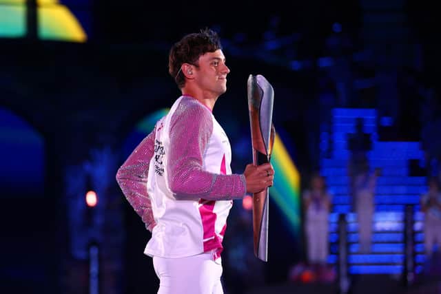 Tom Daley carries the Queen’s Baton during the Opening Ceremony of the Birmingham 2022 Commonwealth Games at Alexander Stadium in Birmingham (Picture: Elsa/Getty Images)
