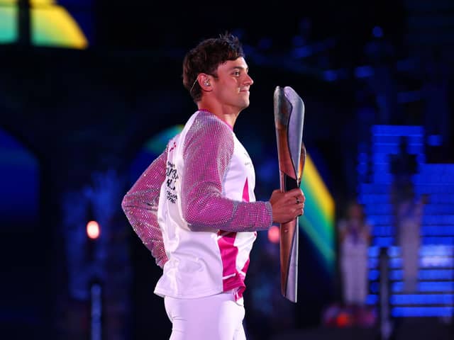 Tom Daley carries the Queen’s Baton during the Opening Ceremony of the Birmingham 2022 Commonwealth Games at Alexander Stadium in Birmingham (Picture: Elsa/Getty Images)