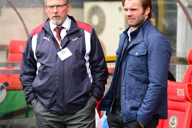 Former Hearts manager Craig Levein (left) and current manager Robbie Neilson.