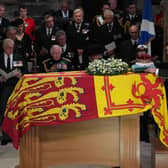 The Earl of Wessex, the Duke of York, King Charles III, the Queen Consort, the Princess Royal and Vice Admiral Sir Tim Laurence, look on as the Duke of Hamilton places the Crown of Scotland on the coffin during the Service of Prayer and Reflection for the Life of Queen Elizabeth II at St Giles' Cathedral